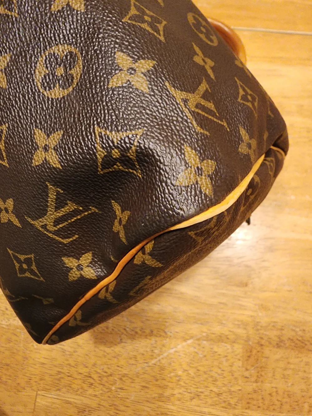 classic Louis Vuitton Monogram Speedy 30 featuring iconic brown coated monogram